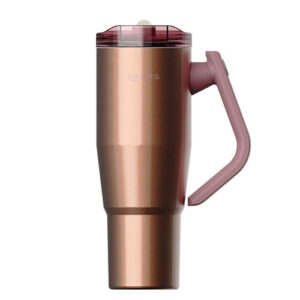 Rose gold insulated travel tumbler with a pink lid and integrated handle, shown from the front.