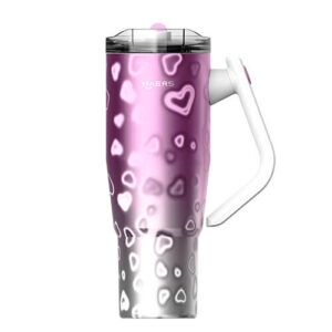 Insulated travel tumbler with pink–purple gradient and white heart pattern, clear lid, and white attached handle.