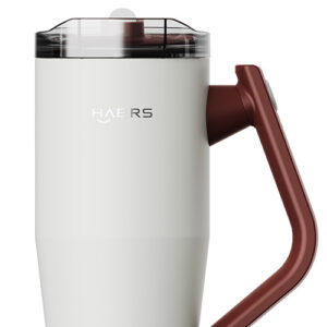 White insulated travel mug with a transparent lid and brown handle, brand text visible on side (HAERS).