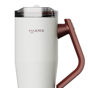 White Haers handheld milk frother with a brown angular handle and transparent lid.