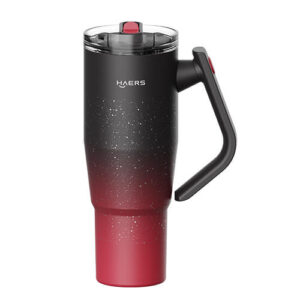 HAERS insulated travel mug with black-to-red gradient, speckled finish, and a side handle with red latch lid.