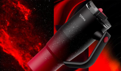 Handheld red-and-black monocular telescope with a curved handle, set against a space-themed background.