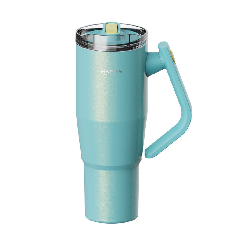 teal stainless steel travel mug with a clear lid and integrated curved handle on the side, branded haers portland-style cup.