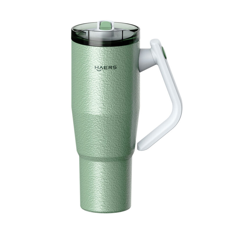 green textured insulated travel mug with a white ergonomic handle and flip-top lid (haers)