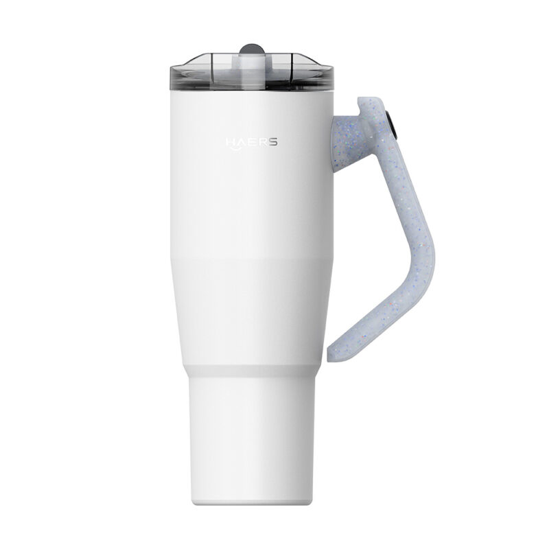 white insulated travel mug with a speckled light-blue handle and a translucent flip-top lid.