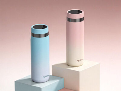 two pastel water bottles with metallic rims on white and blue blocks against a pink gradient background.