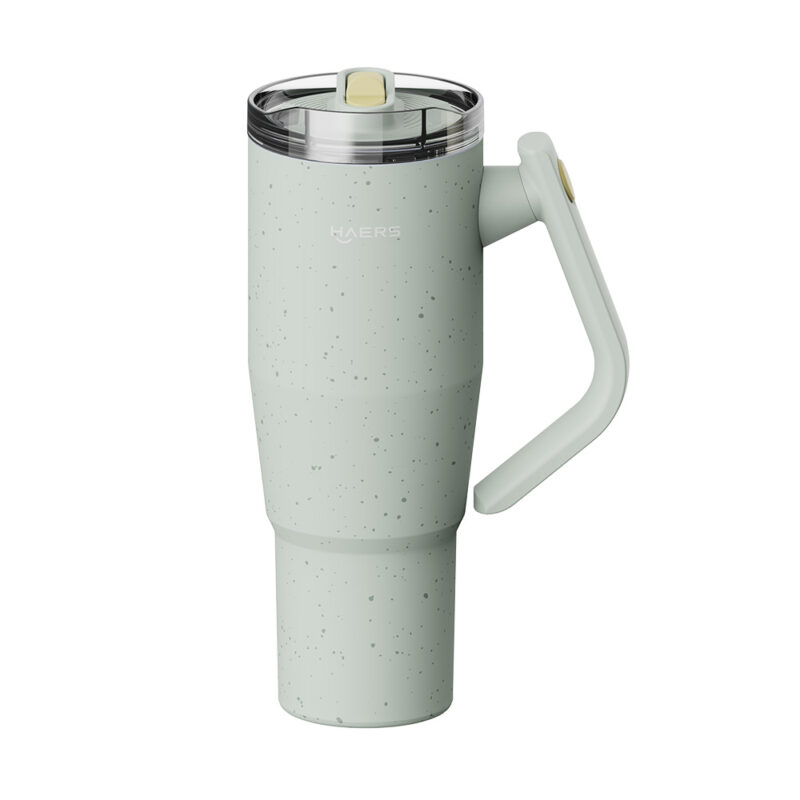 mint green speckled travel mug with clear lid and on-right hinged handle.