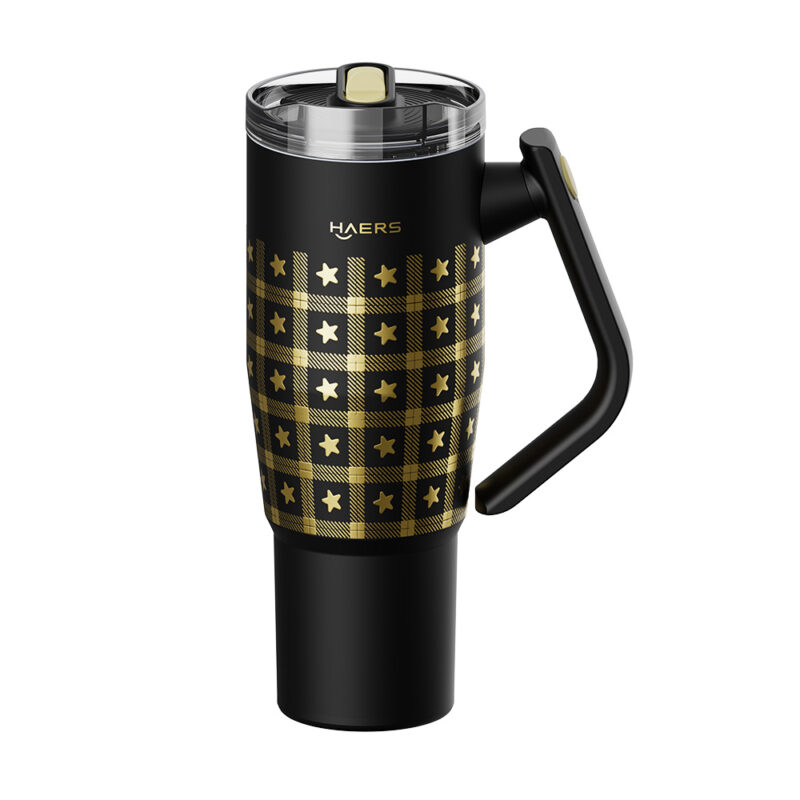 travel mug with black body and gold star plaid pattern, handle on the right, haers branding visible, spill‑proof lid on top